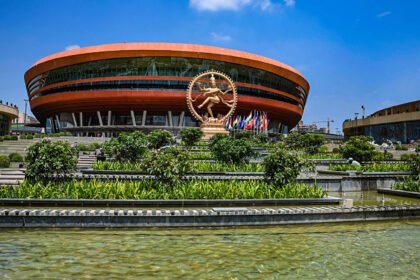 Flag of India flying at a diplomatic summit in New Delhi.